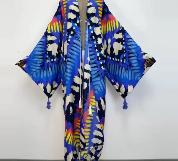 A blue and yellow kimono with colorful feathers.