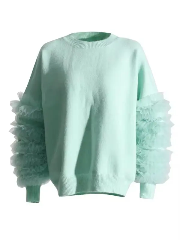 A light blue sweater with tulle sleeves.